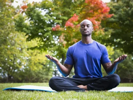 depositphotos_125995482-stock-photo-young-man-exercising-yoga